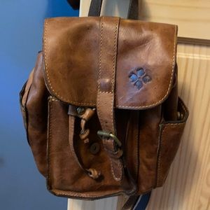 Backpack style purse one big pocket few little pockets inside